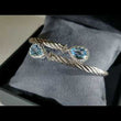 Load and play video in Gallery viewer, Gabriel &amp; Co. Steel and Sterling Silver Blue Topaz Cable Bangle

