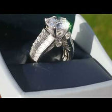 Load and play video in Gallery viewer, Simon G. Large Center Baguette Diamond Engagement Ring
