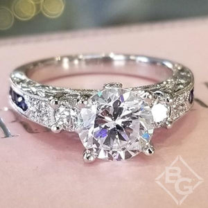 Kirk Kara White Gold "Charlotte" Three Stone Blue Sapphire Diamond Engagement Ring Front View 