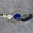 Load image into Gallery viewer, Simon G. Oval Cut Bezel Set Blue Sapphire and Diamond Ring Front View In Box
