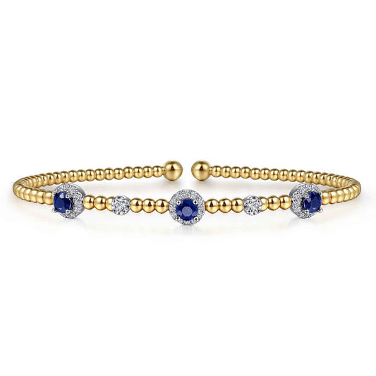 Gabriel & Co. BG4438 Bujukan bangle in 14K white and yellow gold with a blue sapphire and diamond halo