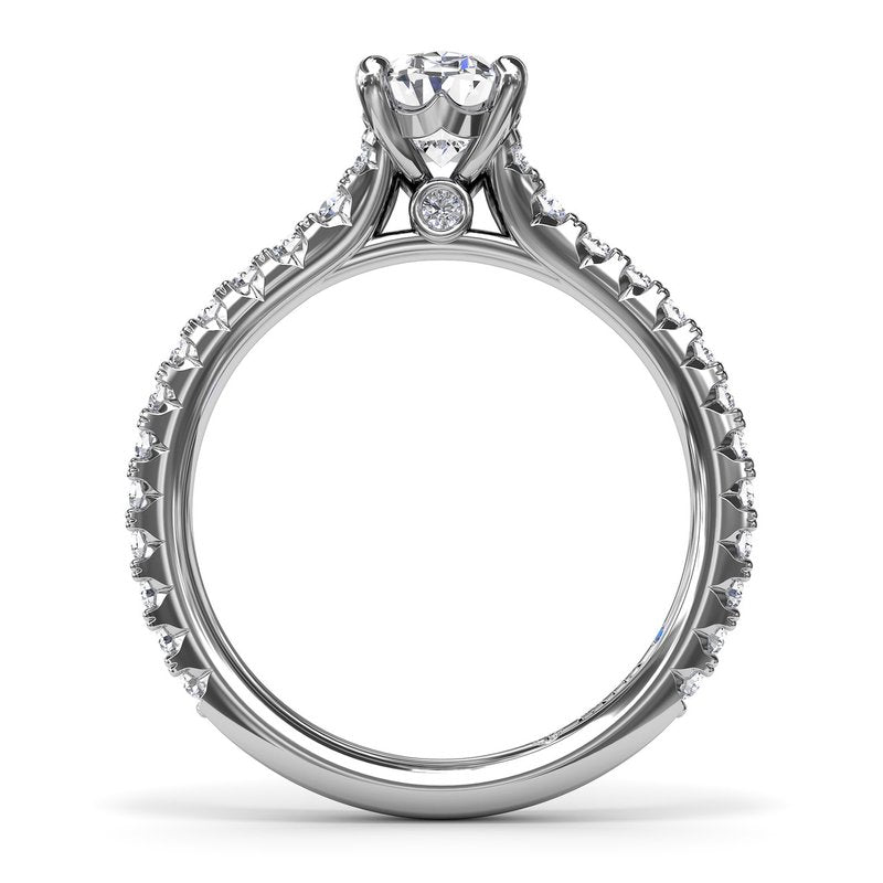 Fana 14K White Gold Sophisticated Side Cluster Oval Center Diamond Engagement Ring Featuring 1.48 Carats of Round Cut Prong Set Diamonds.