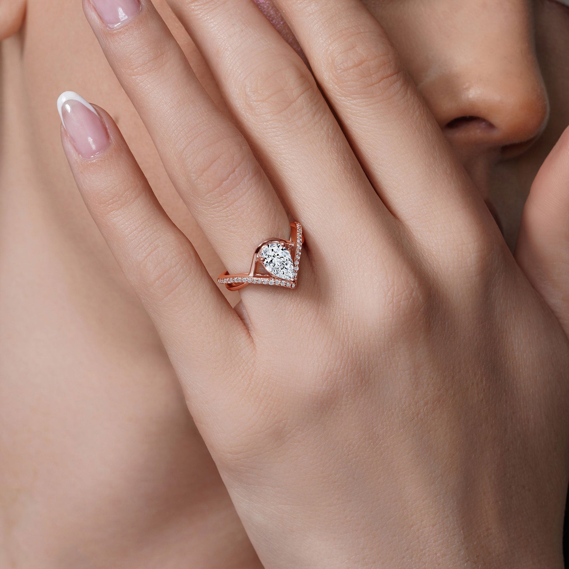 Barkev's Rose Gold Split Shank Twist Pear Cut Diamond Engagement Ring on Finger