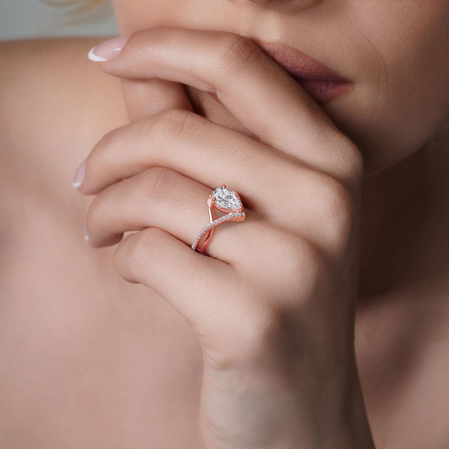 Barkev's Rose Gold Split Shank Twist Pear Cut Diamond Engagement Ring on Finger