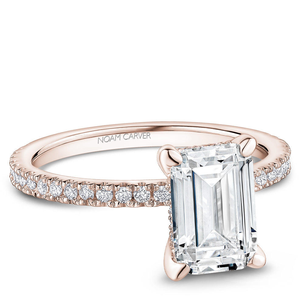 Noam Carver Rose Gold Prong Set Hidden Halo Emerald Cut Diamond Engagement Ring Featuring 0.30 Carats Total Weight Round Cut Shared Prong Set Diamonds.