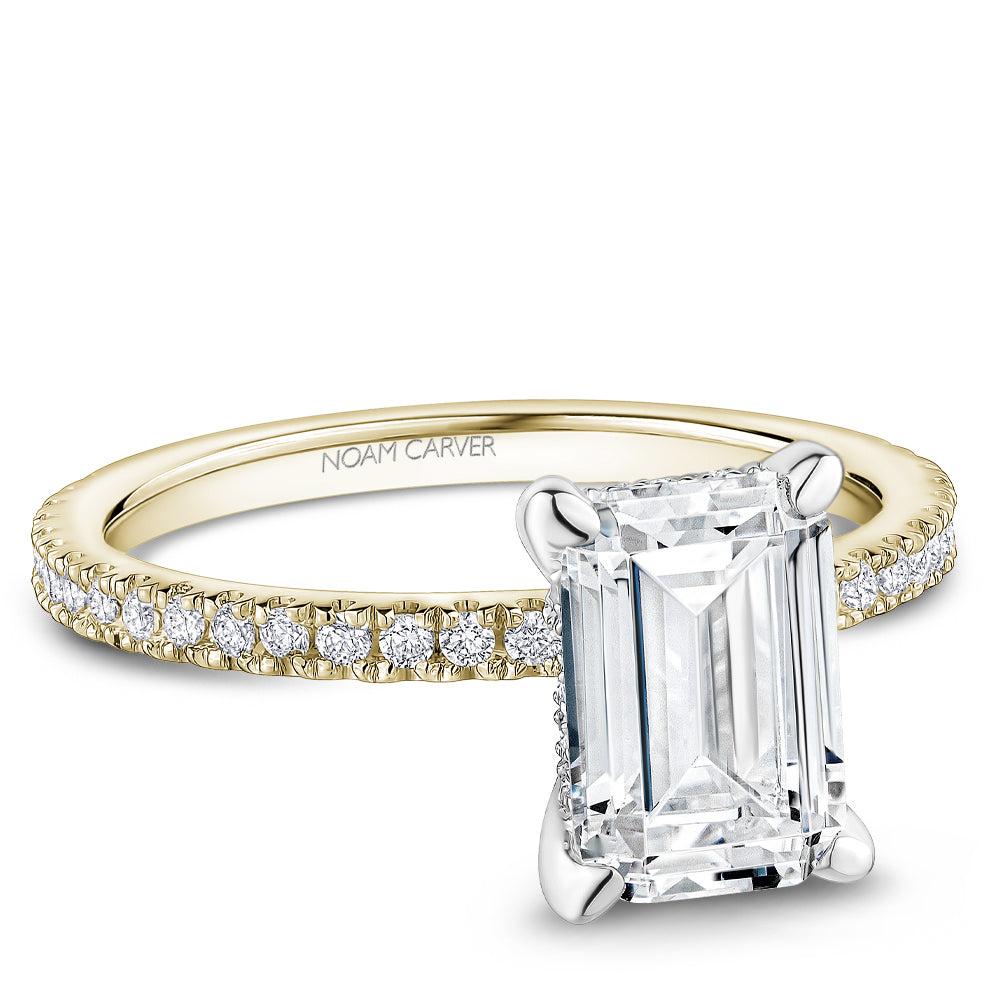 Noam Carver Yellow & White Gold Prong Set Hidden Halo Emerald Cut Diamond Engagement Ring Featuring 0.30 Carats Total Weight Round Cut Shared Prong Set Diamonds.