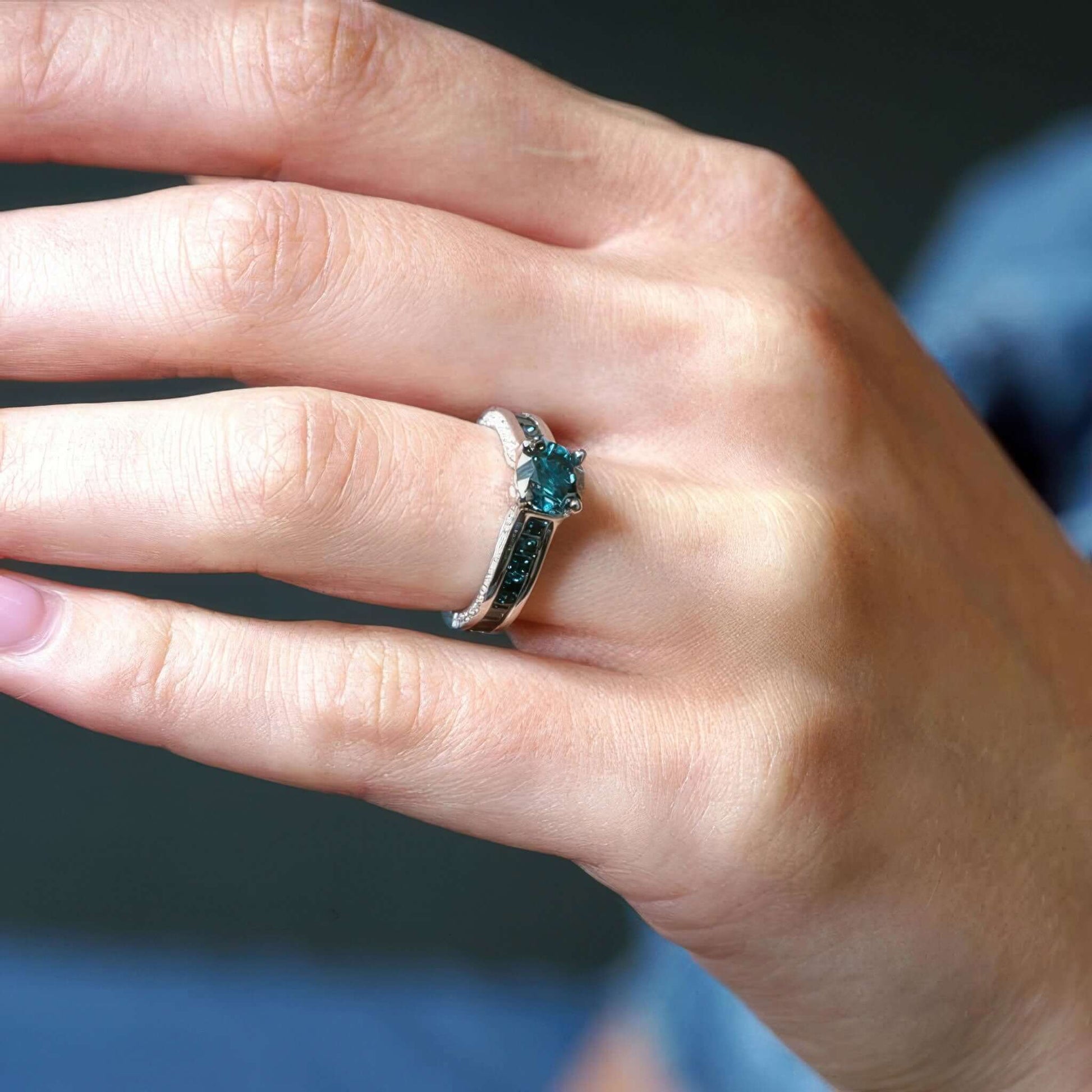 Barkev's Princess Cut Channel Set Blue Diamond Engagement Ring on Hand