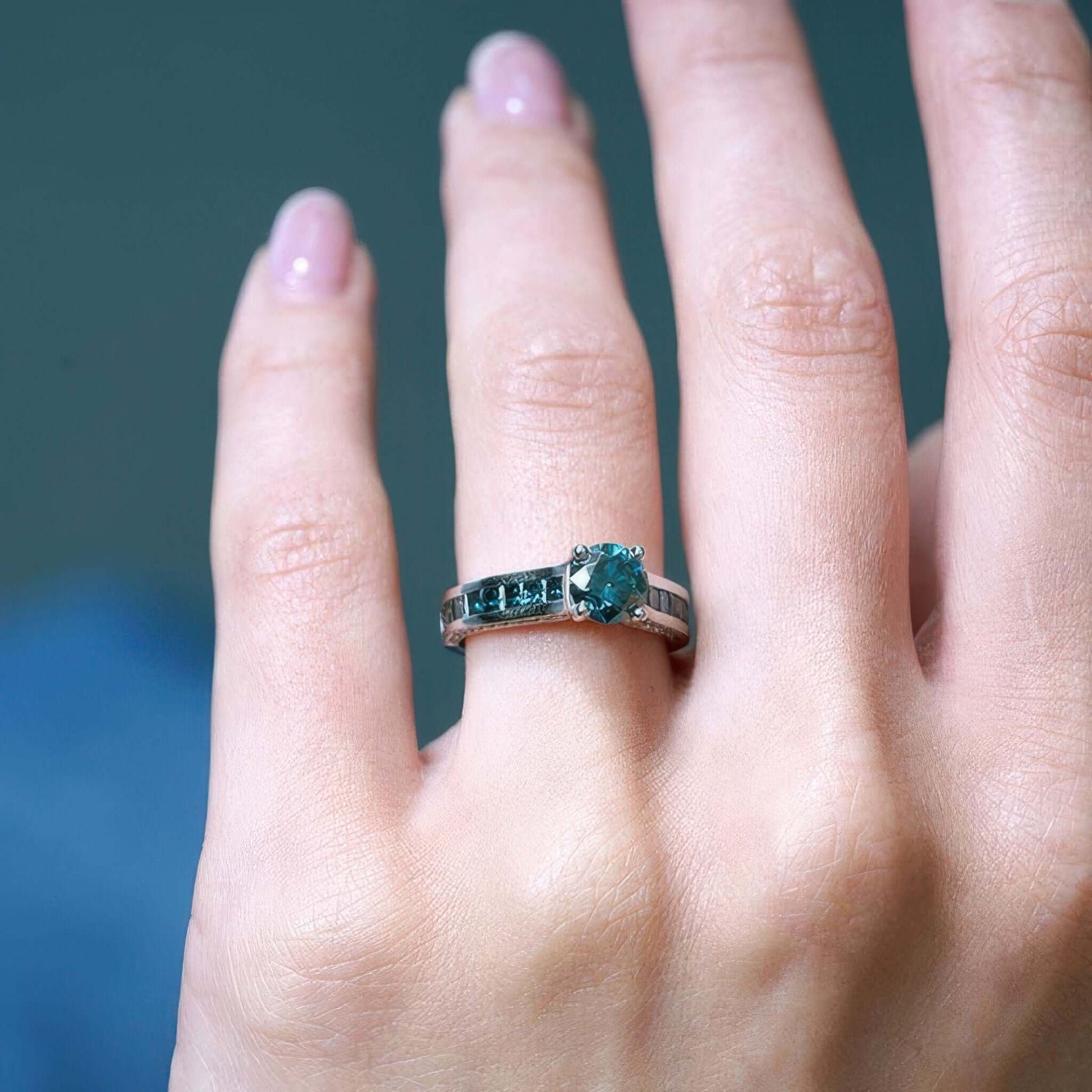 Barkev's Princess Cut Channel Set Blue Diamond Engagement Ring on Hand
