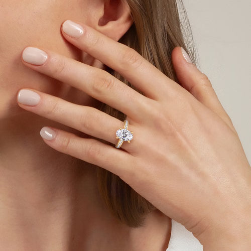 Gabriel & Co. Olya 14K yellow gold oval cathedral engagement ring with 0.25 ct channel-set diamonds at Ben Garelick Jewelers On Hand