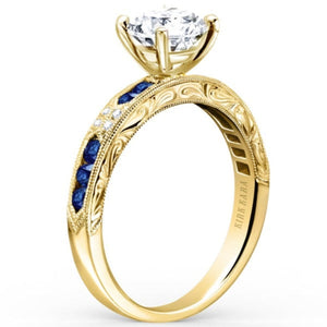Kirk Kara Yellow Gold "Charlotte" Blue Sapphire Diamond Engagement Ring Angled Side View 