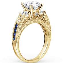 Load image into Gallery viewer, Kirk Kara Yellow Gold &quot;Charlotte&quot; Three Stone Blue Sapphire Diamond Engagement Ring Angled Side View
