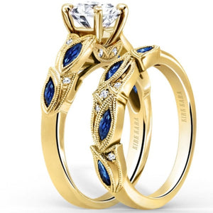Kirk Kara Yellow Gold "Dahlia" Marquise Cut Blue Sapphire Diamond Engagement Ring Set Angled View 