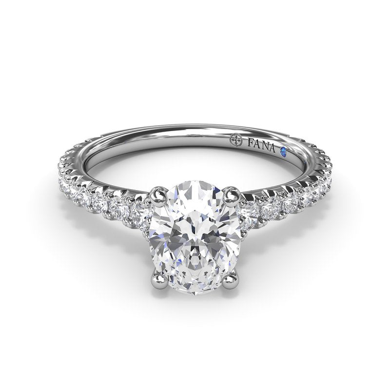 Fana 14K White Gold Sophisticated Side Cluster Oval Center Diamond Engagement Ring Featuring 1.48 Carats of Round Cut Prong Set Diamonds.