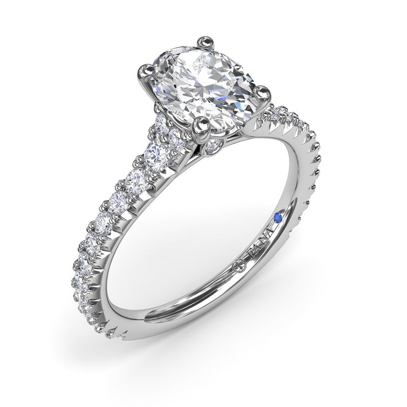 Fana 14K White Gold Sophisticated Side Cluster Oval Center Diamond Engagement Ring Featuring 1.48 Carats of Round Cut Prong Set Diamonds.