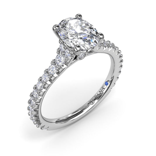 Fana 14K White Gold Sophisticated Side Cluster Oval Center Diamond Engagement Ring Featuring 1.48 Carats of Round Cut Prong Set Diamonds.