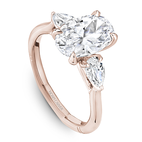 Angled view of the Noam Carver Atelier A092-02 three stone ring in rose gold, pear side diamonds on a soft square Euro shank