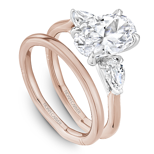 Angled view of the Noam Carver Atelier A092-02 three stone ring in two-tone rose & white gold, pear side diamonds on a soft square Euro shank