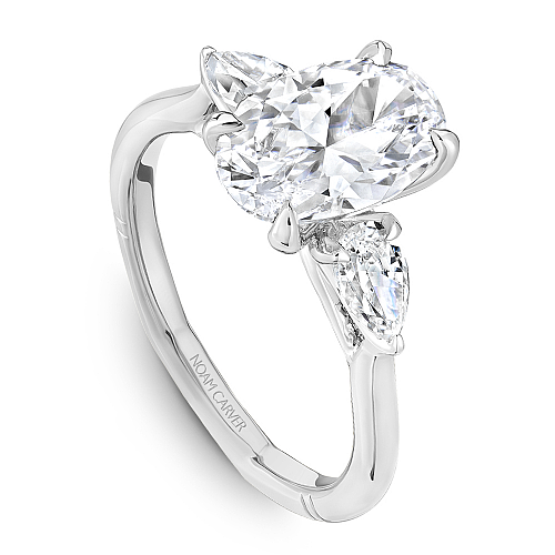Angled view of the Noam Carver Atelier A092-02 three stone ring in white gold, pear side diamonds on a soft square Euro shank