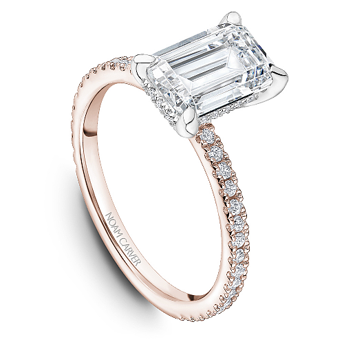 Noam Carver Rose & White Gold Prong Set Hidden Halo Emerald Cut Diamond Engagement Ring Featuring 0.30 Carats Total Weight Round Cut Shared Prong Set Diamonds.
