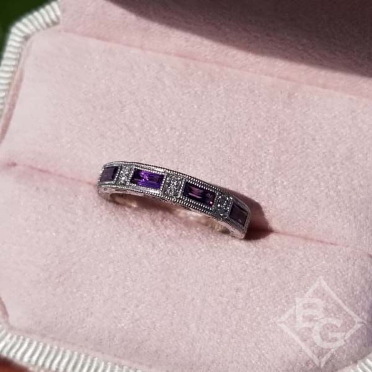 Kirk Kara White Gold "Charlotte" Baguette Cut Purple Amethyst Diamond Wedding Band Angled Top View In Box