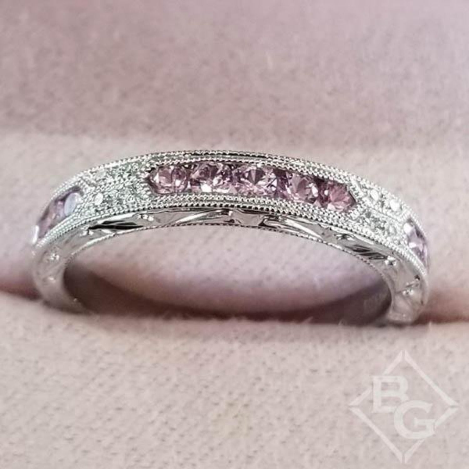 Kirk Kara White Gold "Charlotte" Pink Sapphire Round Cut Diamond Wedding Band Top View In Box