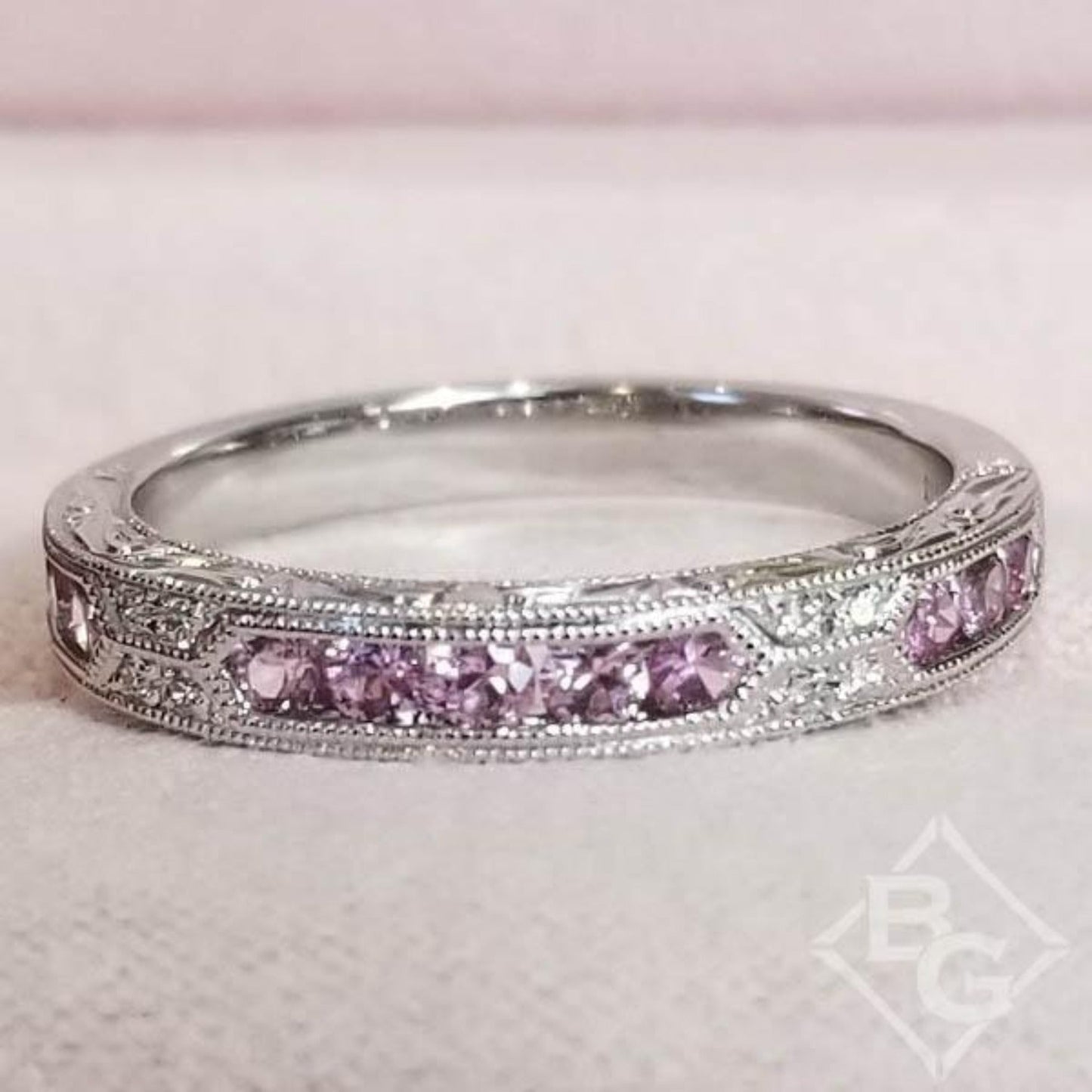 Kirk Kara White Gold "Charlotte" Pink Sapphire Round Cut Diamond Wedding Band Front View In Box