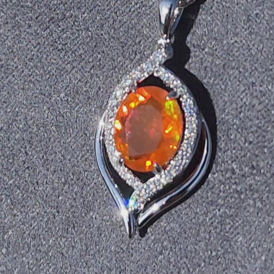 Video of the Simon G. Mexican Fire Opal Halo Diamond Swirl Pendant