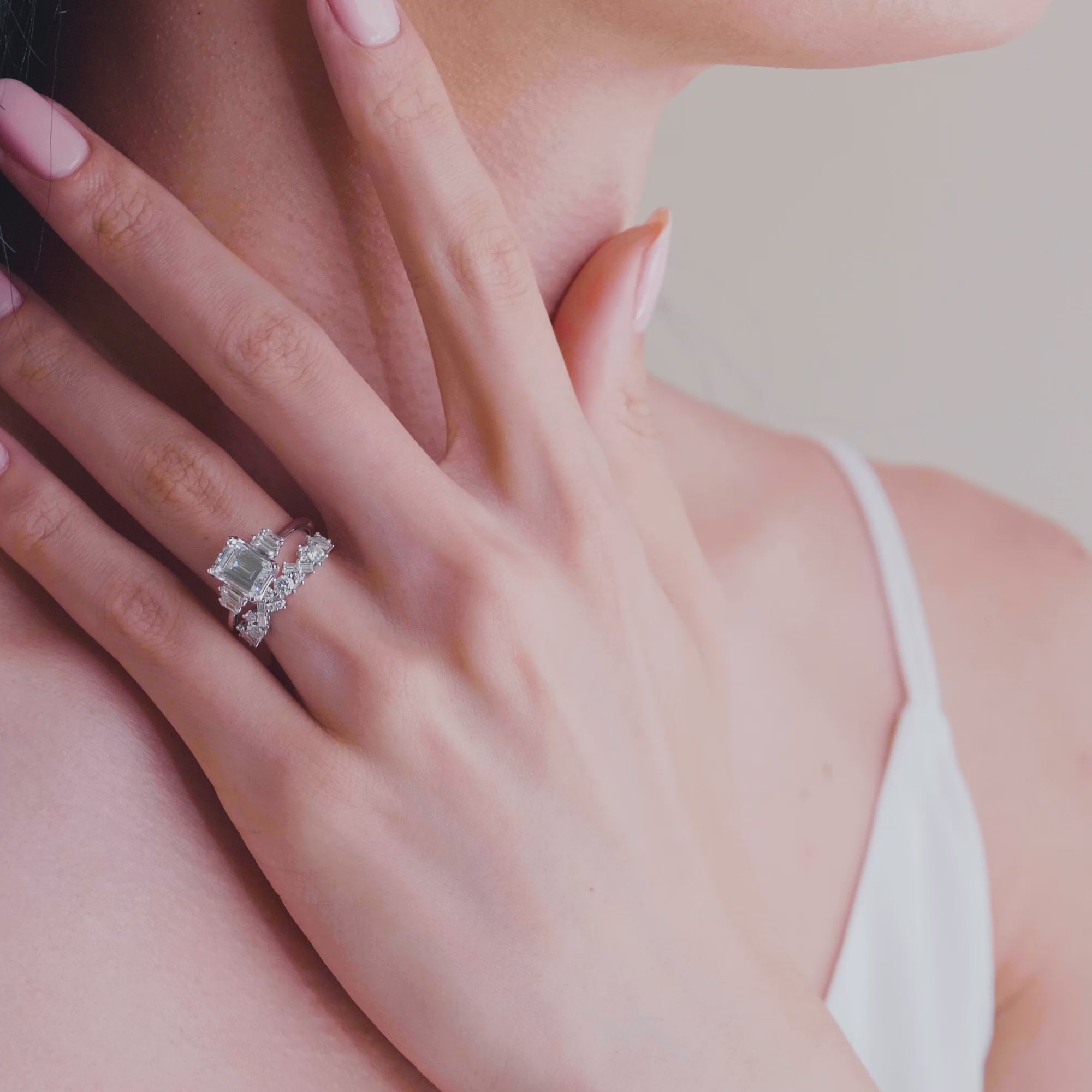 Kirk Kara White Gold Stella Five Stone Emerald and Baguette Diamond Engagement Ring Video on Model Hand with Wedding band 