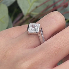 Load and play video in Gallery viewer, Barkev&#39;s Tension Twist Half Bezel Set Princess Cut Diamond Baguette Engagement Ring
