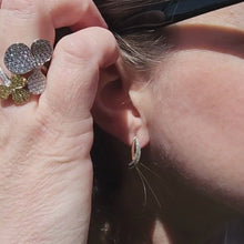 Load and play video in Gallery viewer, Simon G. Two-Tone Graduating Diamond Wave Earrings on Ear
