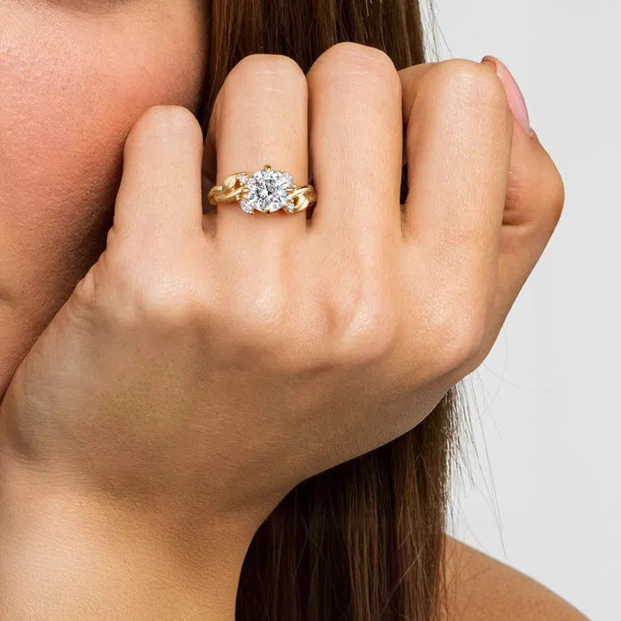 Gabriel & Co. Yellow Gold Darling Floral Nouveau Yellow Gold Prong Round  1.5 Carat Diamond Twisted Engagement Ring on hand