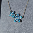 Load and play video in Gallery viewer, Video of Gabriel Lusso Blue Topaz and Diamond Flower Necklace in Box
