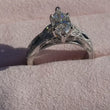 Load and play video in Gallery viewer, Kirk Kara Dahlia Marquise Cut Blue Sapphire Engagement Ring in Ring Box
