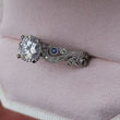 Load and play video in Gallery viewer, Video of Kirk Kara Angelique Scroll Work Blue Sapphire Engagement Ring
