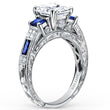 Load image into Gallery viewer, Kirk Kara White Gold &quot;Charlotte&quot; Blue Sapphire Diamond Three Stone Engagement Ring Angled Side View
