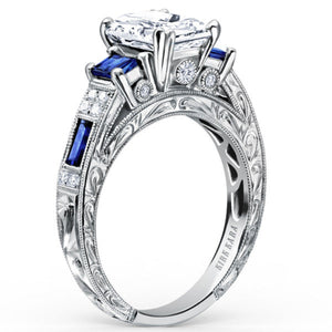 Kirk Kara White Gold "Charlotte" Blue Sapphire Diamond Three Stone Engagement Ring Angled Side View