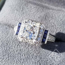 Load image into Gallery viewer, Gabriel &quot;Daisy&quot; Cushion Shaped Blue Sapphire Diamond Engagement Ring
