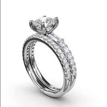Load and play video in Gallery viewer, Fana Round Cut with Side Baguette Diamond Engagement Ring
