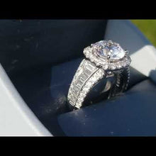 Load and play video in Gallery viewer, Simon G. Large Center Halo Diamond Baguette Cut Engagement Ring
