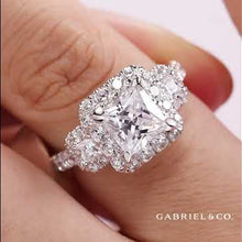 Load and play video in Gallery viewer, Gabriel &amp; Co. &quot;Gibson&quot; Three Stone Halo Diamond Engagement Ring
