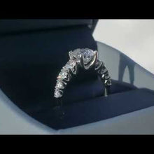 Load and play video in Gallery viewer, Simon G. Large Round Center Graduating U Prong Diamond Engagement Ring
