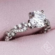 Load image into Gallery viewer, Kirk Kara White Gold &quot;Angelique&quot; Diamond Scrollwork Engagement Ring In Box Angled Side View
