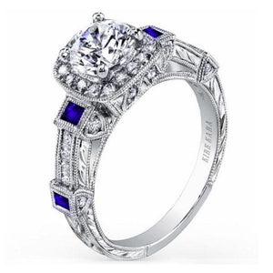 Kirk Kara White Gold "Carmella" Cushion Halo Baguette Station Blue Sapphire Diamond Engagement Ring Angled Side View