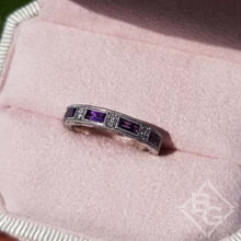 Load image into Gallery viewer, Kirk Kara White Gold &quot;Charlotte&quot; Baguette Cut Purple Amethyst Diamond Wedding Band Angled Top View In Box
