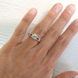 Load image into Gallery viewer, Kirk Kara White Gold &quot;Charlotte&quot; Baguette Cut Red Ruby Diamond Engagement Ring On Model Hand 
