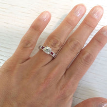 Load image into Gallery viewer, Kirk Kara White Gold &quot;Charlotte&quot; Baguette Cut Red Ruby Diamond Engagement Ring On Model Hand 
