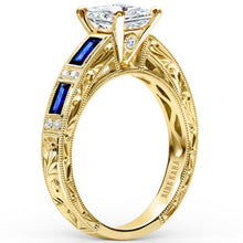 Load image into Gallery viewer, Kirk Kara Yellow Gold &quot;Charlotte&quot; Blue Sapphire Baguette and Diamond Engagement Ring Angled Side View
