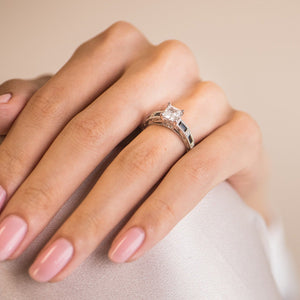 Kirk Kara White Gold "Charlotte" Blue Sapphire Baguette and Diamond Engagement Ring On Model Hand