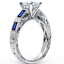 Load image into Gallery viewer, Kirk Kara White Gold &quot;Charlotte&quot; Blue Sapphire Baguette and Diamond Engagement Ring Angled Side View

