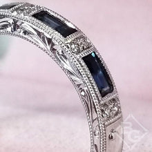 Load image into Gallery viewer, Kirk Kara White Gold &quot;Charlotte&quot; Blue Sapphire Baguette Cut Diamond Wedding Band Close Up Angled Side View
